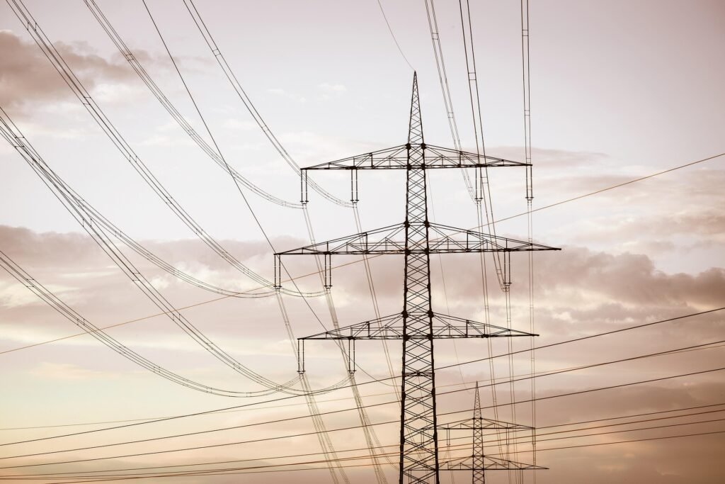 Power lines against a sunset sky